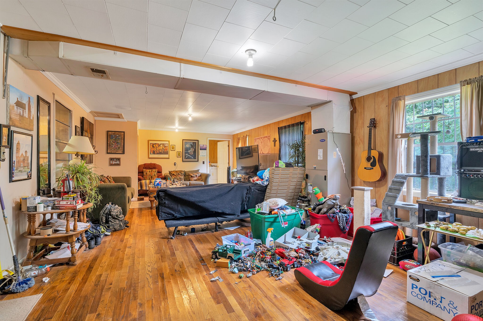 1205 Main Street Altamont, TN 37301 - Photo 37 of 51 a living room filled with furniture hard wood floor and a chandelier