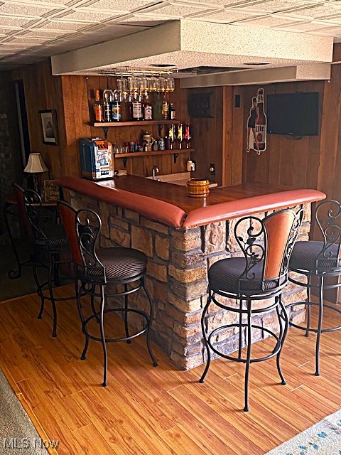 68960 Pine Terrace Road Bridgeport, OH 43912 - Photo 12 of 32 Indoor bar featuring wooden walls and wood finished floors
