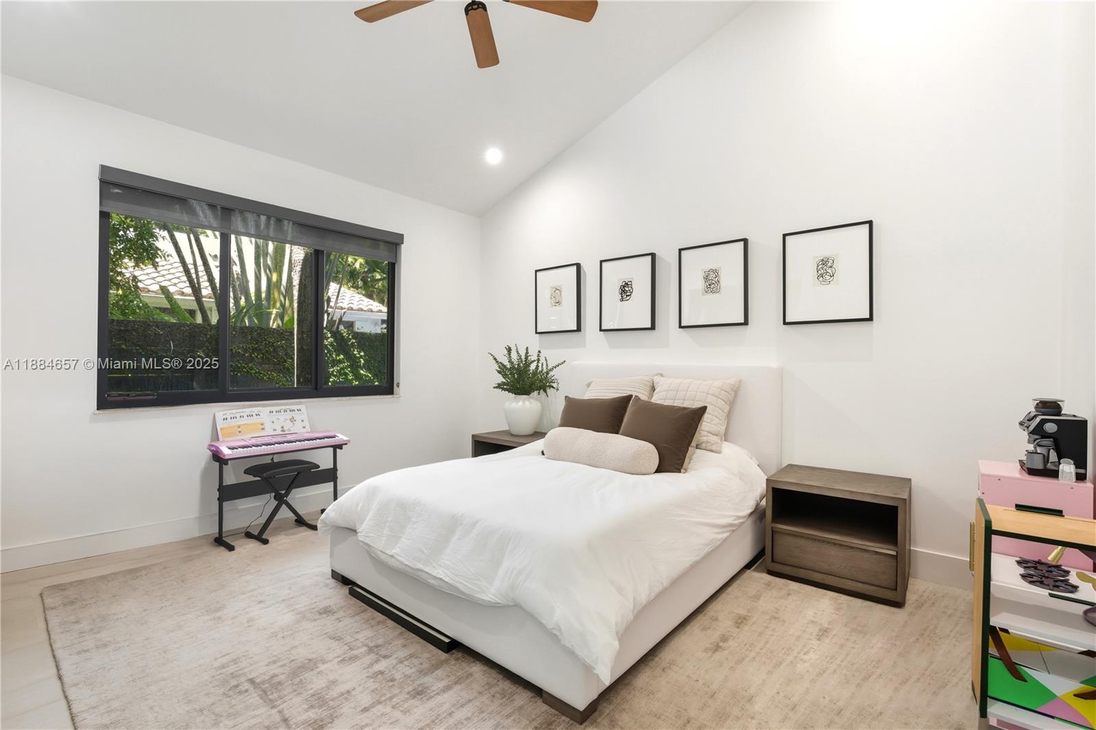 3782 El Prado Boulevard, Unit 1 Miami, FL 33133 - Photo 11 of 30 a bedroom with a bed and a window