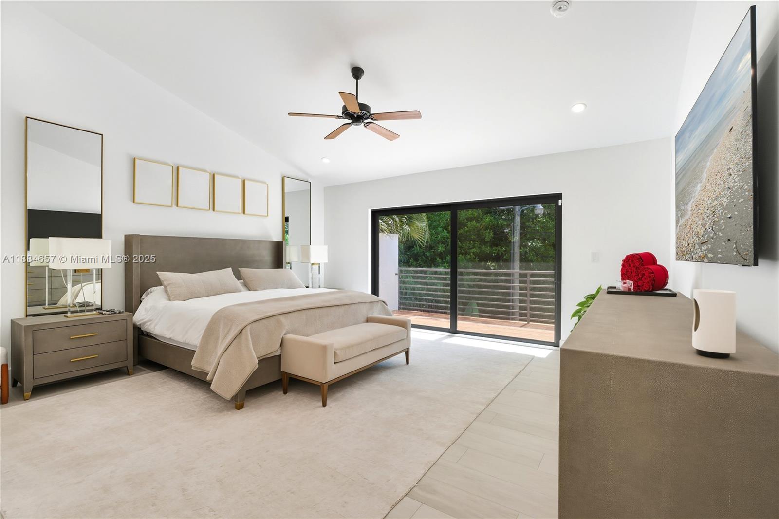 3782 El Prado Boulevard, Unit 1 Miami, FL 33133 - Photo 12 of 30 a spacious bedroom with a bed and a window