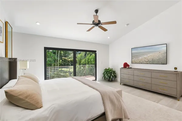 a bed room with a bed and a window