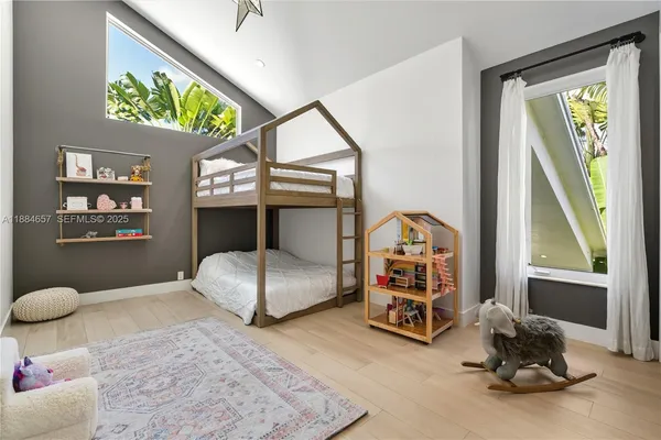 a bedroom with furniture and a window