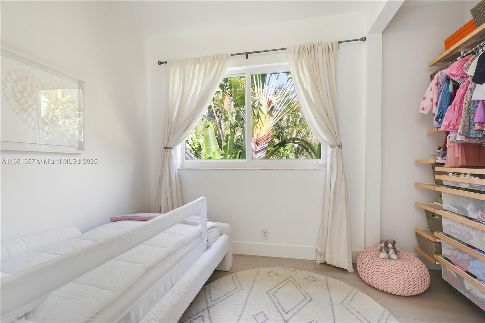 3782 El Prado Boulevard, Unit 1 Miami, FL 33133 - Photo 18 of 30 a bedroom with a bed and a window