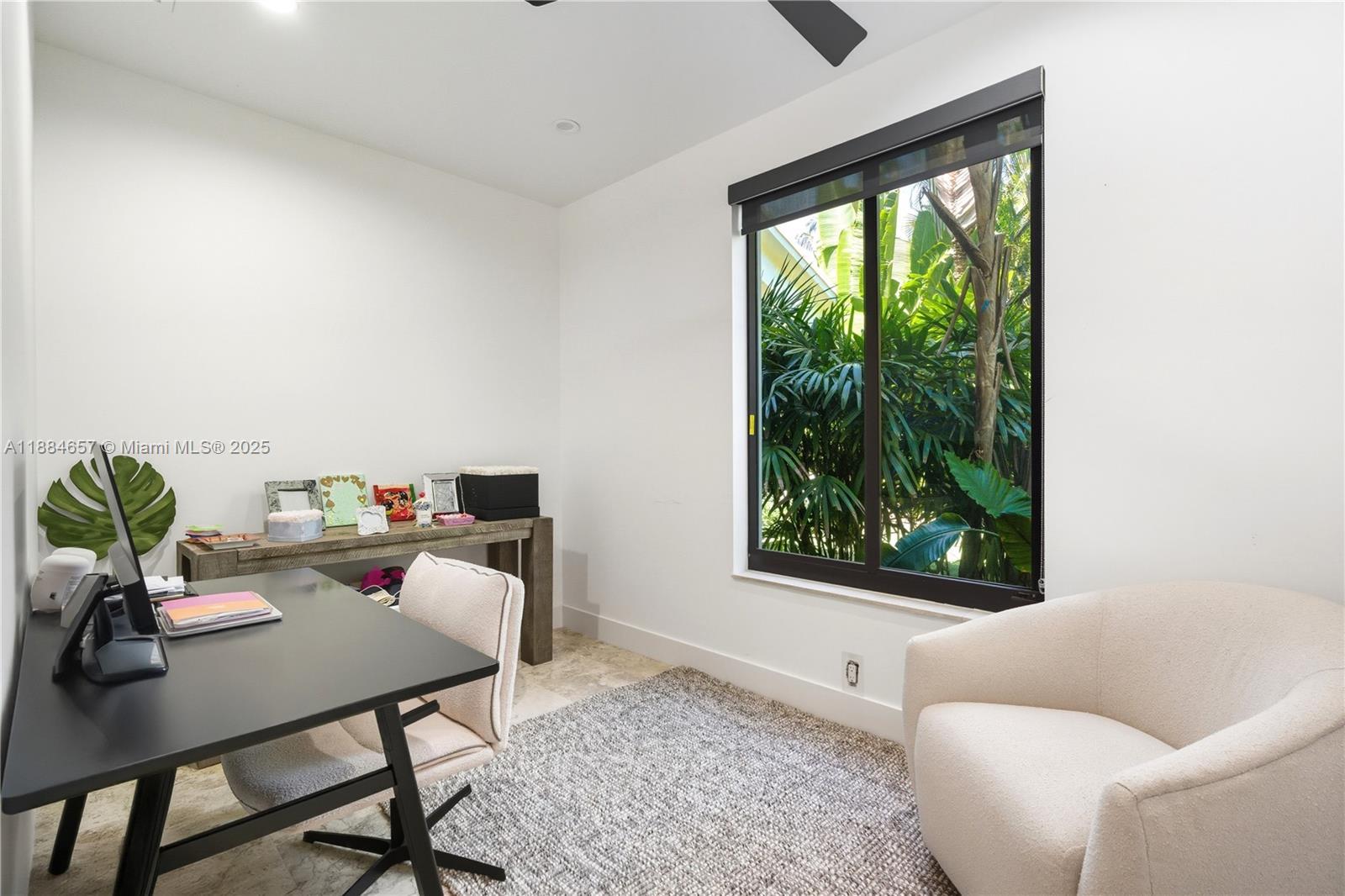 3782 El Prado Boulevard, Unit 1 Miami, FL 33133 - Photo 23 of 30 a living room with furniture and a window