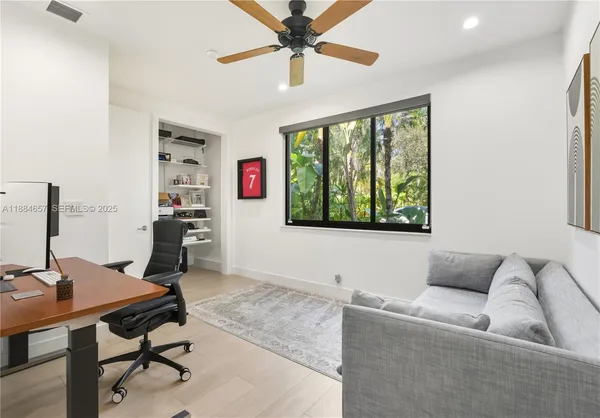 a living room with furniture and a window
