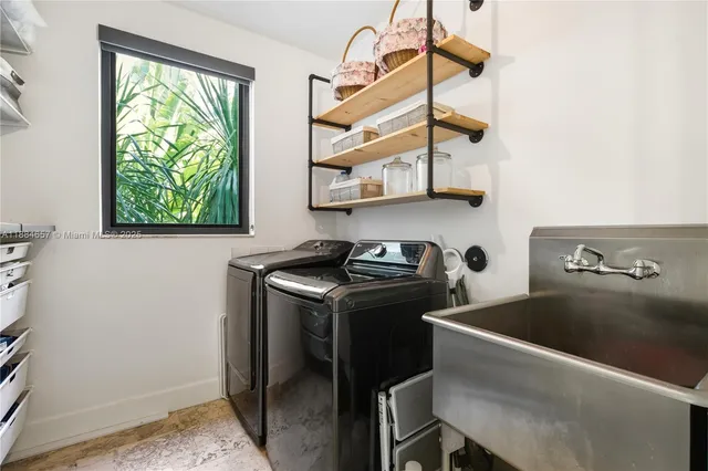 a kitchen with stainless steel appliances granite countertop a stove and a sink