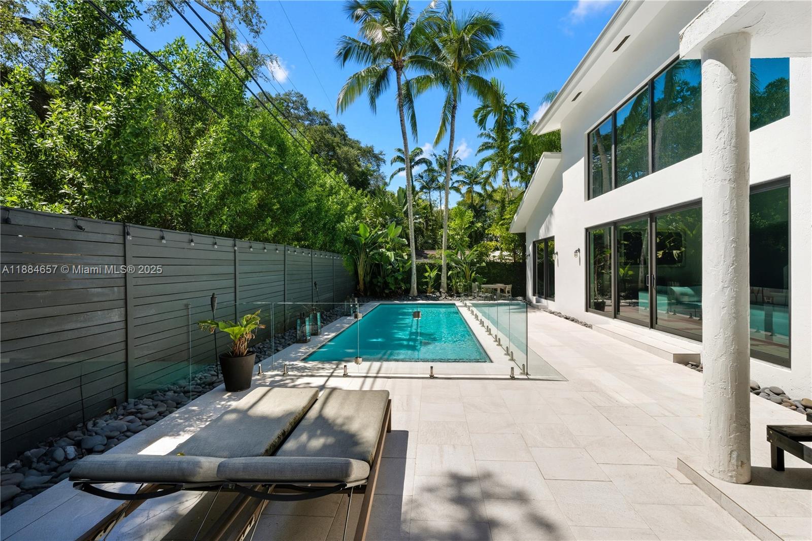 3782 El Prado Boulevard, Unit 1 Miami, FL 33133 - Photo 28 of 30 a view of backyard with plants and outdoor seating