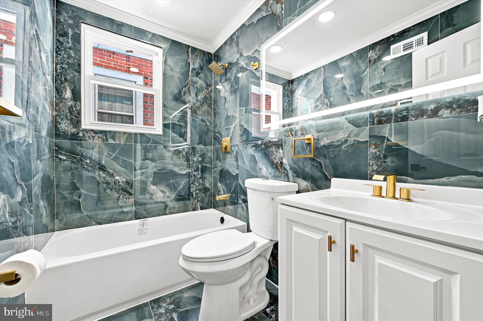 1620 South Yewdall Street Philadelphia, PA 19143 - Photo 34 of 38 a bathroom with a sink a toilet and shower