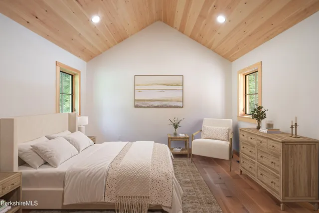 a bedroom with a large bed and furniture