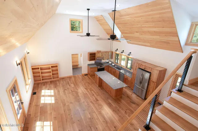 a view of living room with furniture and wooden floor