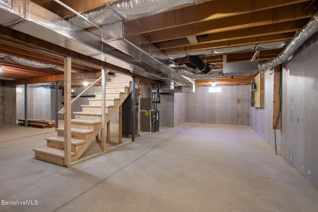 a view of an empty room with stairs