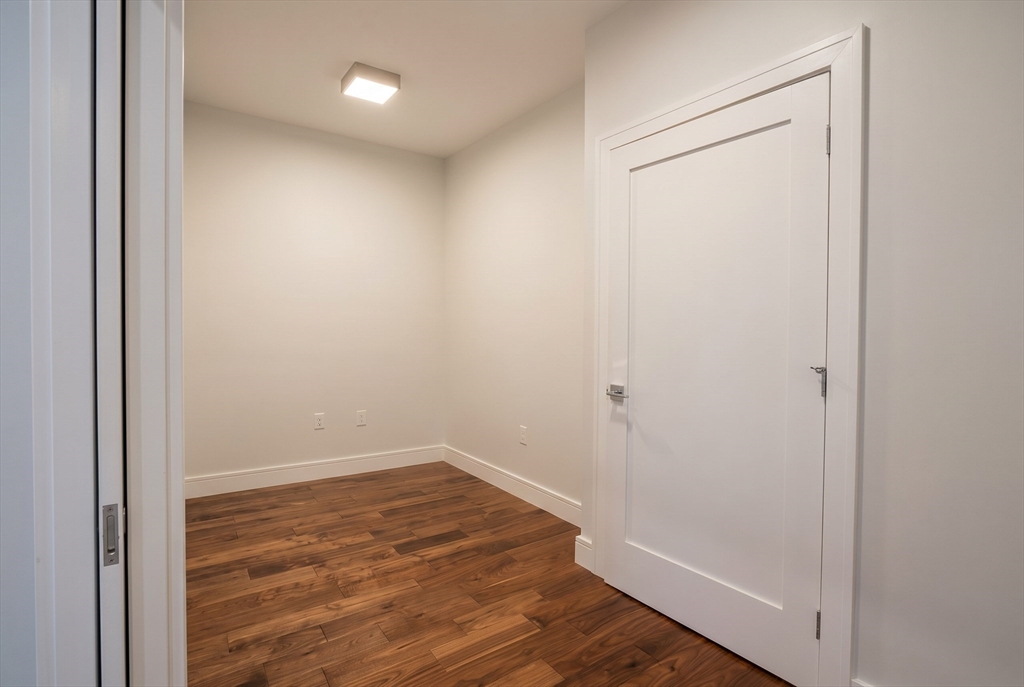 99 Sumner Street, Unit 606 Boston, MA 02128 - Photo 9 of 22 a view of small space with wooden floor