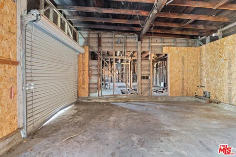 a view of a room with wooden walls