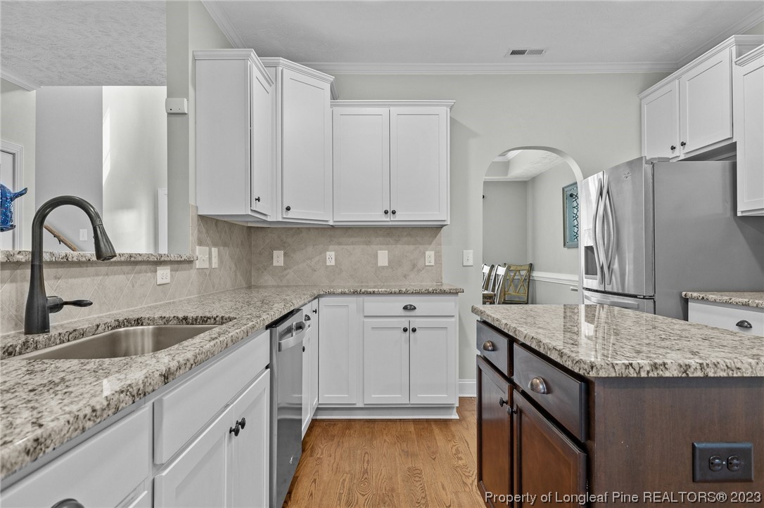 155 Dicks Hill Road Carthage, NC 28327 - Photo 13 of 47 a kitchen with stainless steel appliances granite countertop a sink stove and refrigerator