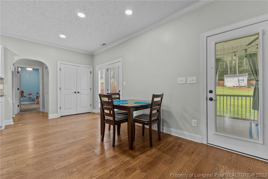 155 Dicks Hill Road Carthage, NC 28327 - Photo 15 of 47 a view of a dining room with furniture and wooden floor