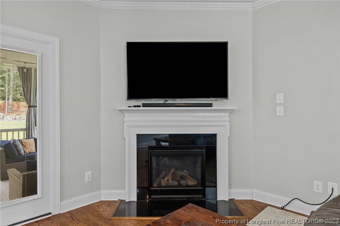 155 Dicks Hill Road Carthage, NC 28327 - Photo 17 of 47 a living room with a fireplace and a flat screen tv