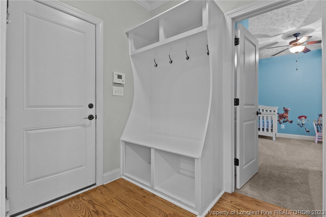 155 Dicks Hill Road Carthage, NC 28327 - Photo 19 of 47 a view of a hallway with wooden floor and entryway