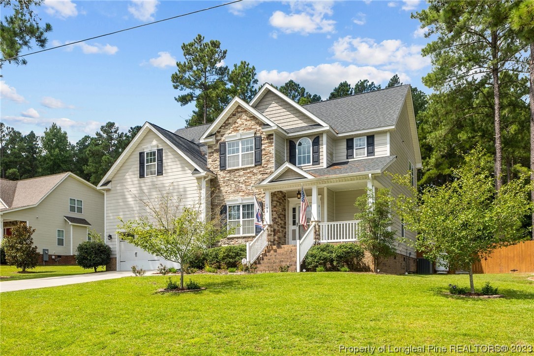 155 Dicks Hill Road Carthage, NC 28327 - Photo 2 of 47 a front view of a house with a yard