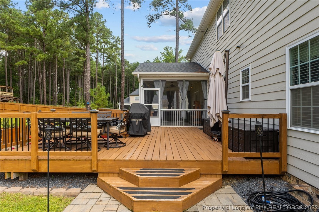 155 Dicks Hill Road Carthage, NC 28327 - Photo 41 of 47 a view of a roof deck with couches and wooden fence