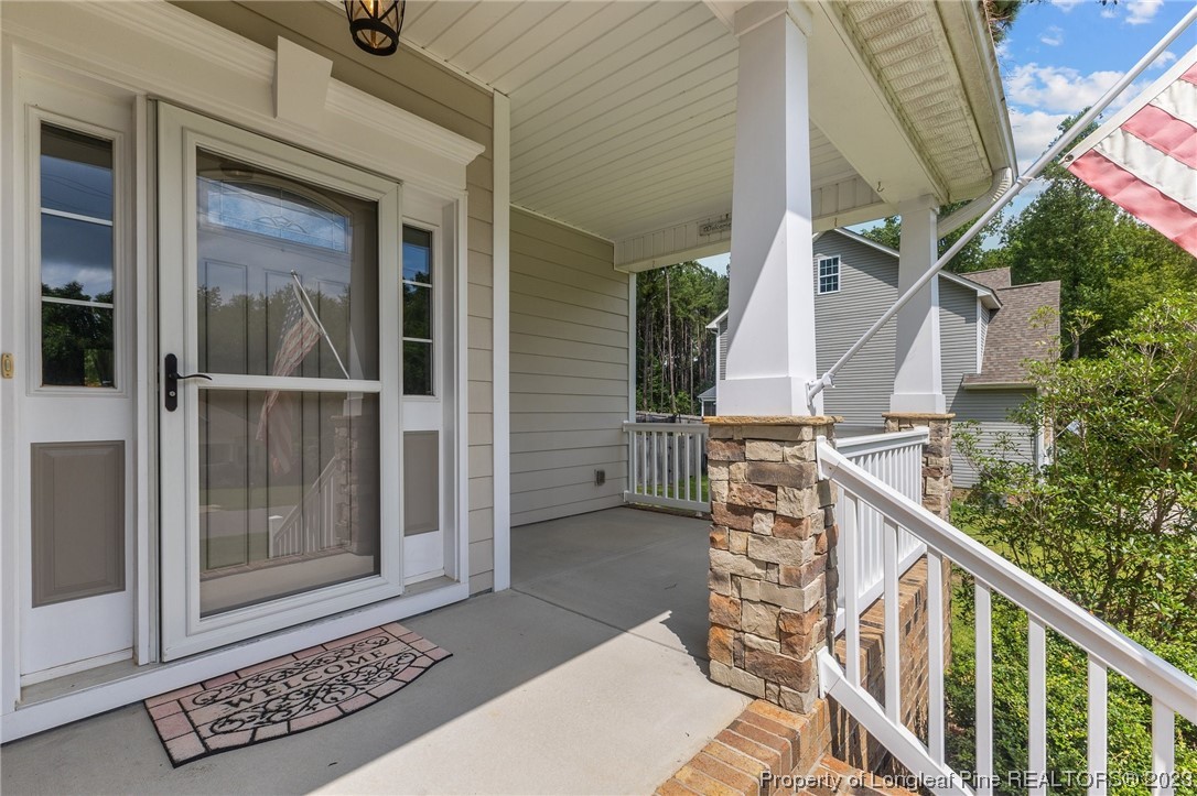 155 Dicks Hill Road Carthage, NC 28327 - Photo 5 of 47 a view of balcony with wooden floor and fence