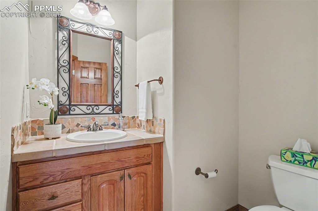 4215 Star Ranch Road Colorado Springs, CO 80906 - Photo 24 of 44 a bathroom with a sink and a mirror