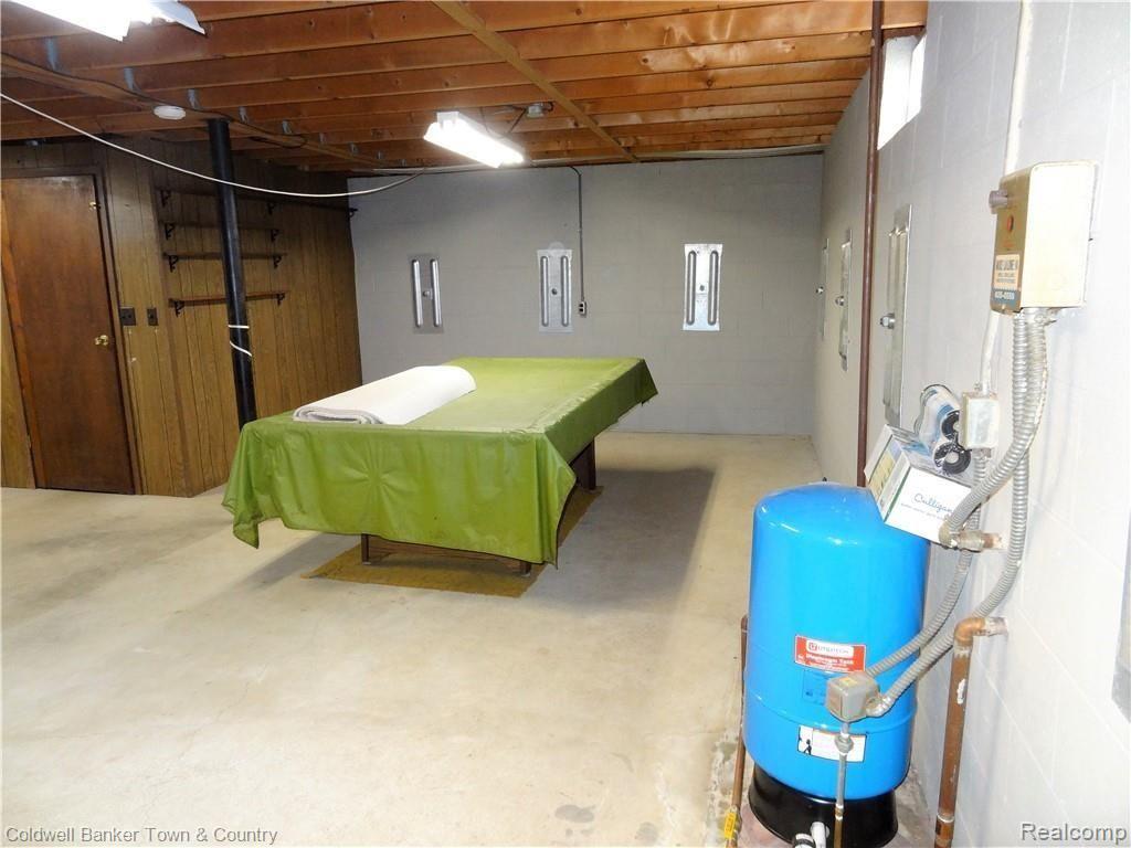 4651 Maybee Road Clarkston, MI 48348 - Photo 22 of 45 Super clean basement with defined storage space. Pool table included! New Foundation Systems of Michigan anchor system. Transferable lifetime warranty.