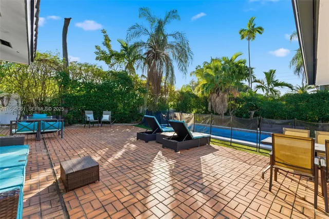 a view of a terrace with sitting area