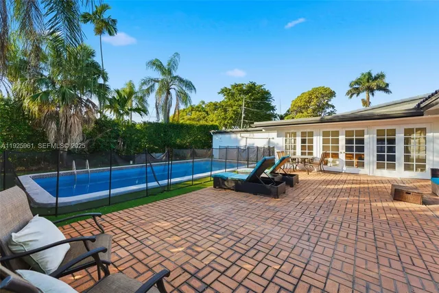 a view of a yard with furniture