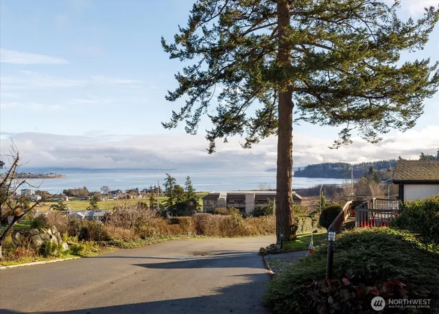 a view of a street with an ocean view
