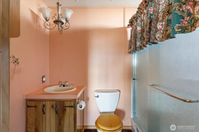 a view of a porch with a table and chairs