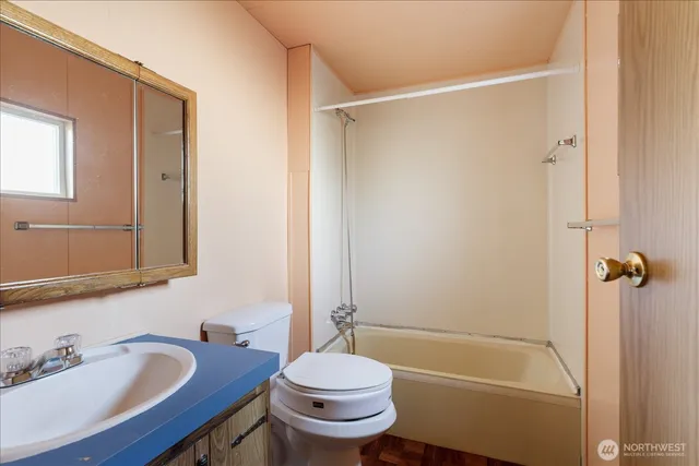 a view of a room with a wooden door