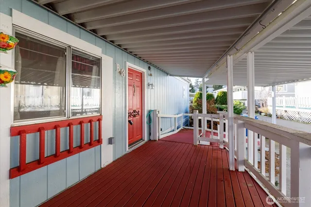 a view of a balcony with furniture