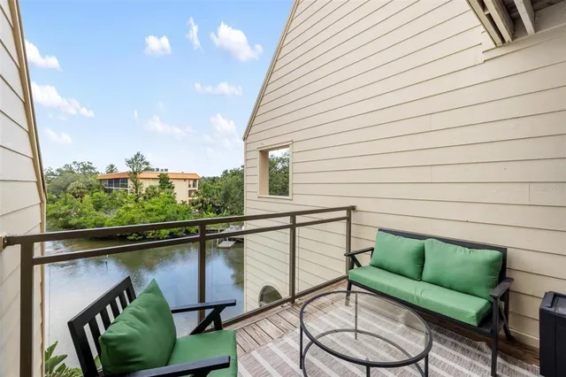 a view of kitchen with refrigerator and window