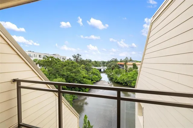 a view of a wooden deck and lake