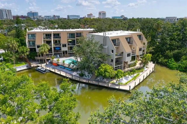 an aerial view of house with a yard and swimming pool