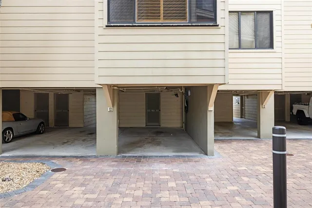 an aerial view of a house with pool table and chairs