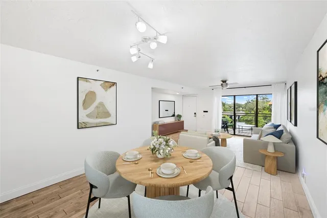 a view of a dining room with furniture window and outside view