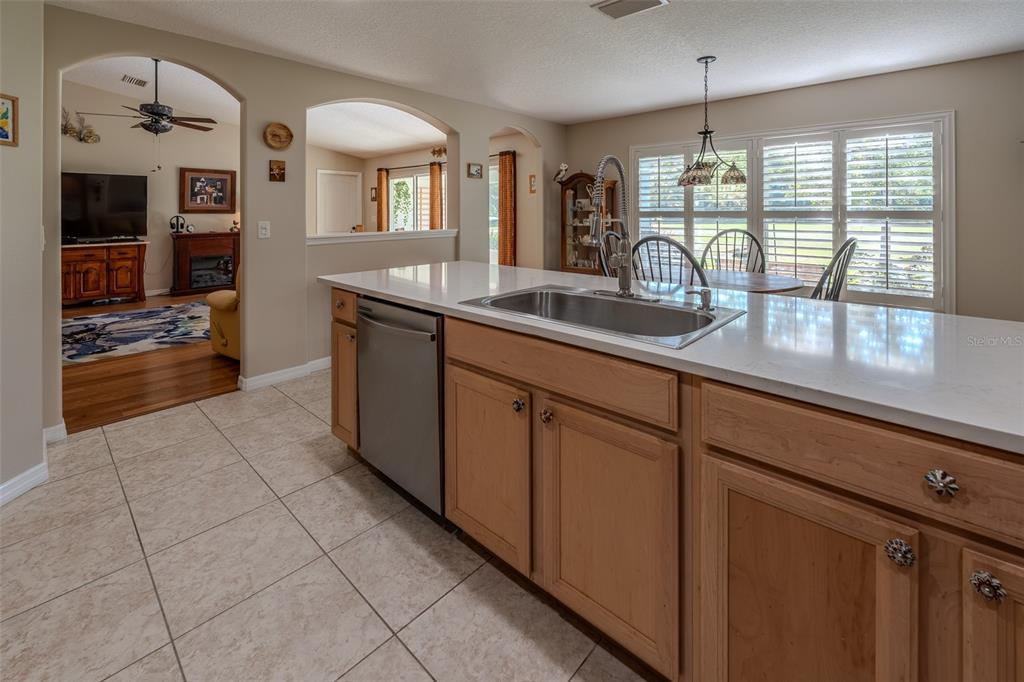 16023 Southwest 14th Avenue Road Ocala, FL 34473 - Photo 16 of 57 a kitchen with stainless steel appliances granite countertop a sink and cabinets
