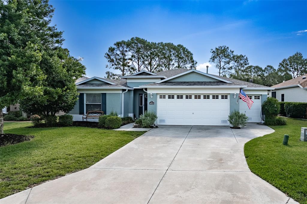 16023 Southwest 14th Avenue Road Ocala, FL 34473 - Photo 2 of 57 a front view of a house with garden