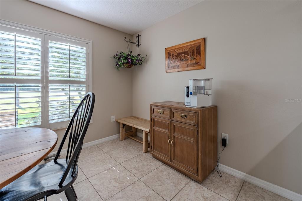 16023 Southwest 14th Avenue Road Ocala, FL 34473 - Photo 22 of 57 a view of a workspace with furniture and a window