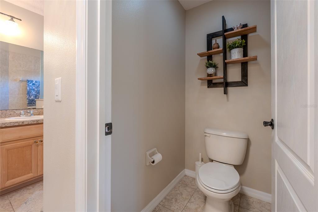 16023 Southwest 14th Avenue Road Ocala, FL 34473 - Photo 31 of 57 a white toilet sitting next to a bathroom sink