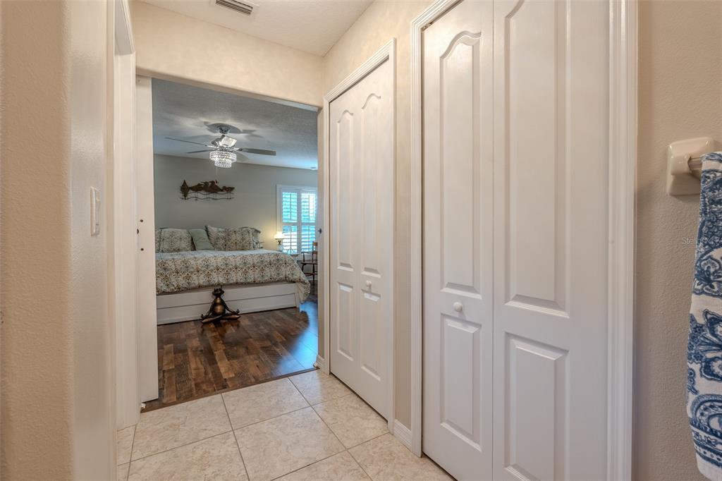 16023 Southwest 14th Avenue Road Ocala, FL 34473 - Photo 32 of 57 a bathroom with a glass shower door and a sink