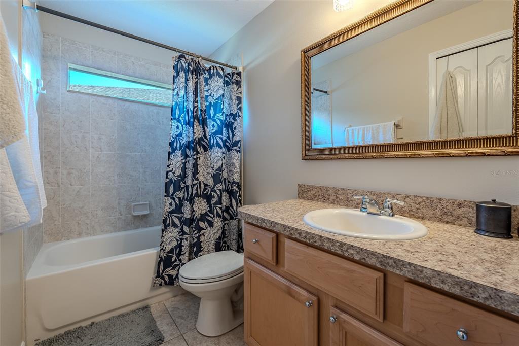 16023 Southwest 14th Avenue Road Ocala, FL 34473 - Photo 35 of 57 a bathroom with a sink a toilet and a bathtub