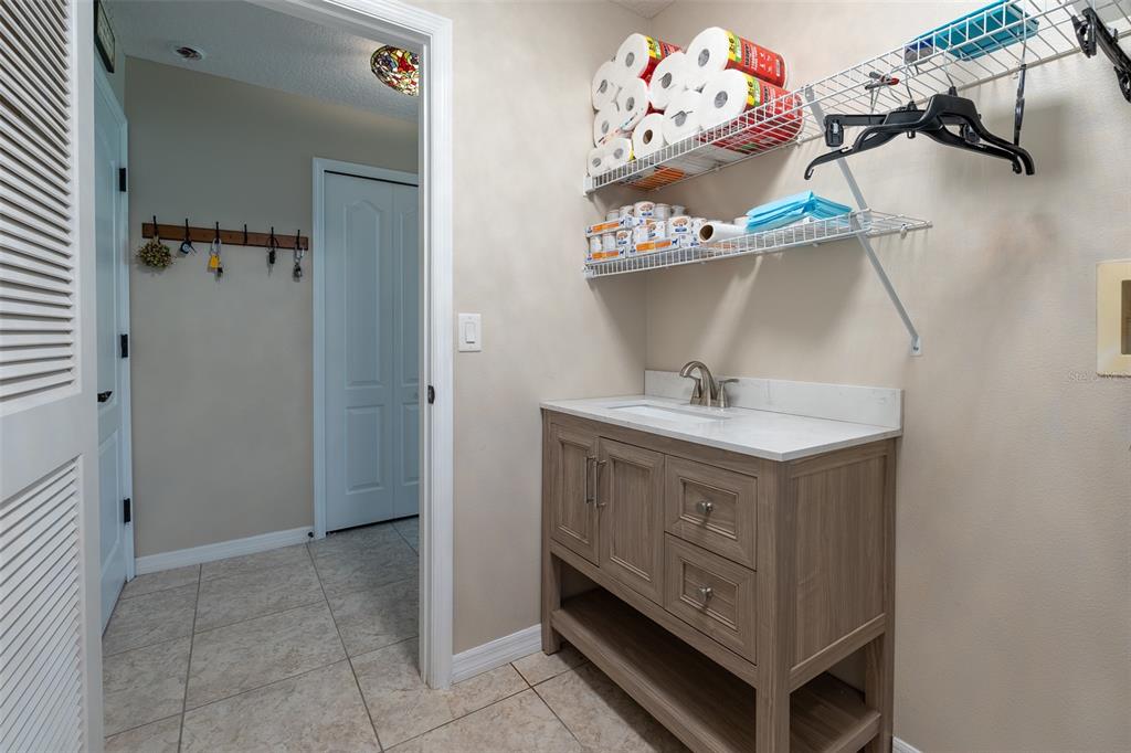 16023 Southwest 14th Avenue Road Ocala, FL 34473 - Photo 41 of 57 a bathroom with a sink mirror and vanity