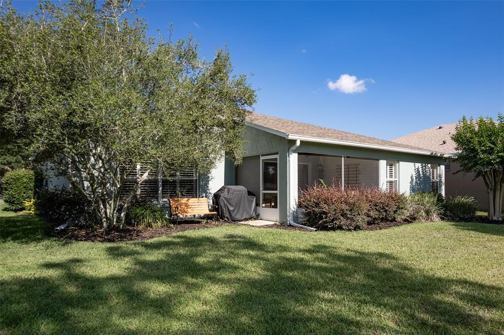 16023 Southwest 14th Avenue Road Ocala, FL 34473 - Photo 48 of 57 a view of a house with backyard and garden