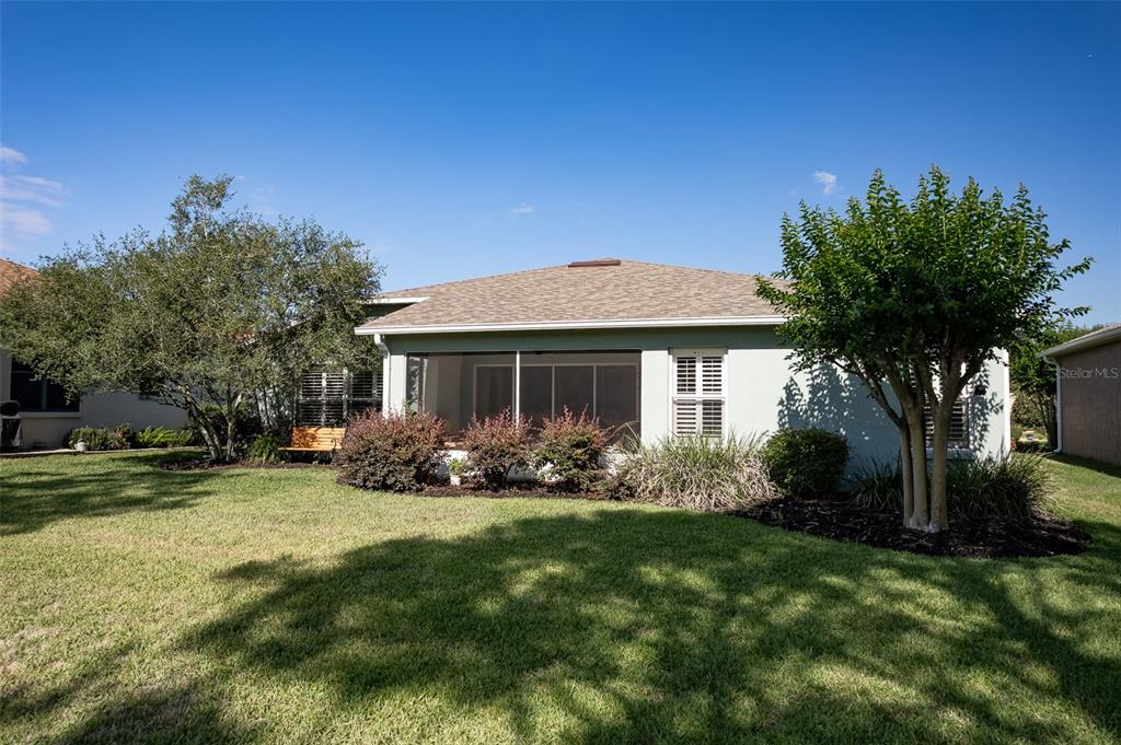 16023 Southwest 14th Avenue Road Ocala, FL 34473 - Photo 49 of 57 a front view of a house with a garden