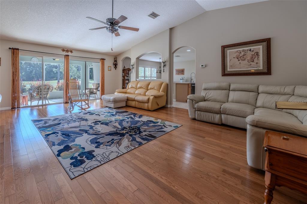 16023 Southwest 14th Avenue Road Ocala, FL 34473 - Photo 5 of 57 a living room with furniture and a rug