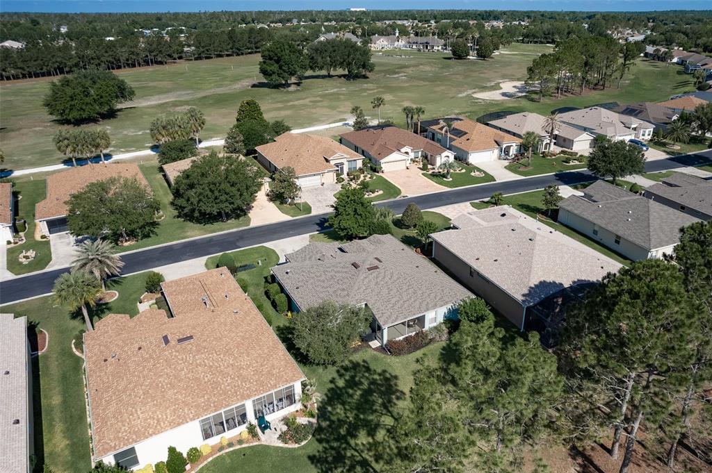16023 Southwest 14th Avenue Road Ocala, FL 34473 - Photo 52 of 57 an aerial view of a house with garden space and lake view