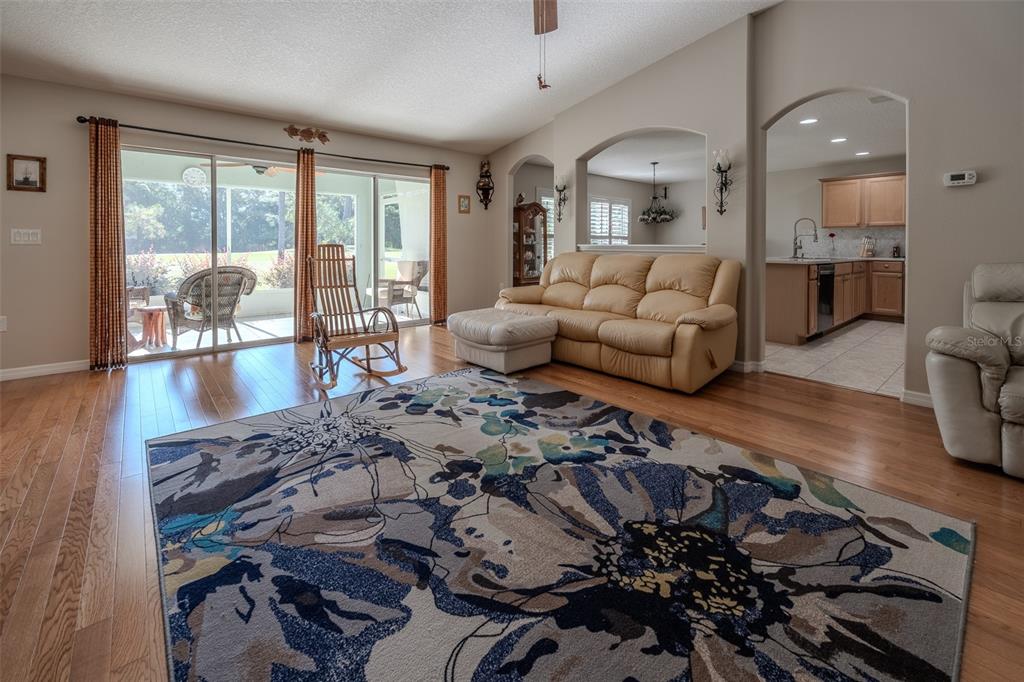 16023 Southwest 14th Avenue Road Ocala, FL 34473 - Photo 6 of 57 a living room with furniture and a large window