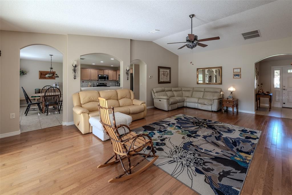 16023 Southwest 14th Avenue Road Ocala, FL 34473 - Photo 8 of 57 a living room with furniture and wooden floor
